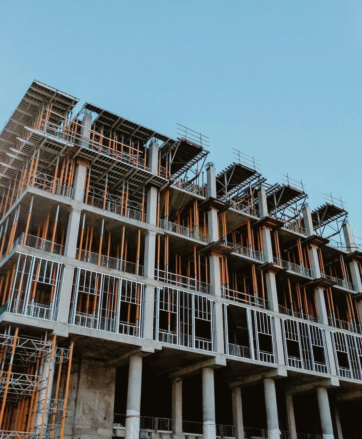 A multifamily building framed and under construction